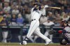 Seattle Mariners' Eugenio Suarez hits a solo home run on a pitch from Atlanta Braves starting pitcher Max Fried during the sixth inning a baseball game, Saturday, Sept. 10, 2022, in Seattle. (AP Photo/John Froschauer)