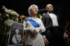 Flowers and a tribute are set up next to wax figures of the late Queen Elizabeth II and her husband Prince Philip, Duke of Edinburgh, at the i-City Red Carpet Wax Museum in Shah Alam, on the outskirts of Kuala Lumpur, Malaysia, Sunday, Sept. 11, 2022. (AP Photo/Vincent Thian)