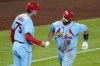 St. Louis Cardinals' Albert Pujols (5) rounds third to greetings from third base coach Ron 'Pop' Warner after hitting a two-run home run off Pittsburgh Pirates starting pitcher JT Brubaker during the sixth inning of a baseball game in Pittsburgh, Saturday, Sept. 10, 2022. (AP Photo/Gene J. Puskar)