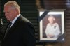 Premier Doug Ford stands in front of a photo of Queen Elizabeth II at Queen's Park in Toronto, Friday, Sept. 9, 2022. Ontario's lieutenant governor and premier will proclaim the accession of King Charles III today. THE CANADIAN PRESS/Alex Lupul