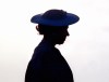 Queen Elizabeth II is silhouetted in Barbados in 1989 during welcoming ceremonies at the airport. A new poll suggests most Canadians feel no attachment to the British monarchy, and that few have been personally impacted by Queen Elizabeth’s death. THE CANADIAN PRESS/AP-Peter Bregg