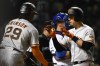 San Francisco Giants' Wilmer Flores, right, celebrates with teammate Lewis Brinson (29) after hitting a two-run home run during the eighth inning of a baseball game against the Chicago Cubs Sunday, Sept. 11, 2022, in Chicago. San Francisco won 4-2. (AP Photo/Paul Beaty)