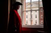 Chelsea pensioner David Godwin, 70, poses next to a window of the Royal Hospital Chelsea after taking part to a Drumhead Service of Remembrance for the late Britain's Queen Elizabeth II, in London, Tuesday, Sept. 13, 2022.(AP Photo/Alberto Pezzali)