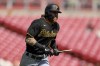Pittsburgh Pirates' Ben Gamel hits a broken bat single during the fourth inning of the first game of a baseball doubleheader against the Cincinnati Reds in Cincinnati, Tuesday, Sept. 13, 2022. (AP Photo/Aaron Doster)