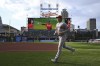 Los Angeles Angels' Shohei Ohtani jogs before the team's baseball game against the Cleveland Guardians, Tuesday, Sept. 13, 2022, in Cleveland. (AP Photo/David Dermer)