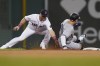 Boston Red Sox's Christian Arroyo, left, tags out New York Yankees' Aaron Judge on an attempted steal during the third inning of a baseball game Tuesday, Sept. 13, 2022, in Boston. (AP Photo/Steven Senne)