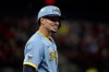Milwaukee Brewers' Willy Adames stands on first after hitting an RBI single during the second inning of a baseball game against the St. Louis Cardinals Tuesday, Sept. 13, 2022, in St. Louis. (AP Photo/Jeff Roberson)