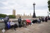 Members of the public join the queue on the South Bank, as they wait to view Queen Elizabeth II lying in state ahead of her funeral, in London, Wednesday Sept. 14, 2022. (Stefan Rousseau/PA via AP)