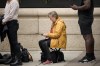 People queue to bid farewell to Queen Elizabeth II in London, Wednesday, Sept. 14, 2022. Queen Elizabeth II, Britain's longest-reigning monarch and a rock of stability across much of a turbulent century, died Thursday Sept. 8, 2022, after 70 years on the throne, at the age of 96. (AP Photo/Andreea Alexandru)