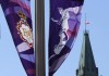 The flag on the Peace Tower flies at half-mast behind banners of Queen Elizabeth celebrating the Platinum Jubilee, in Ottawa, Thursday, Sept.8, 2022. Members of Parliament of all political stripes are expected to rise in tribute to the late Queen Elizabeth today during a special sitting of the House of Commons. THE CANADIAN PRESS/Adrian Wyld