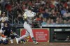 Oakland Athletics' Seth Brown (15) watches his three-run home run along with Houston Astros catcher Christian Vazquez during the fifth inning of a baseball game Saturday, Sept. 17, 2022, in Houston. (AP Photo/David J. Phillip)