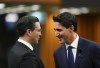 Prime Minister Justin Trudeau and Conservative leader Pierre Poilievre greet each other as they gather in the House of Commons on Parliament Hill to pay tribute to Queen Elizabeth in Ottawa on Thursday, Sept. 15, 2022. A new poll suggests Trudeau enjoys a slight lead over Poilievre when it comes to which leader Canadians feel would make the best prime minister. THE CANADIAN PRESS/Sean Kilpatrick