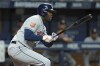 Houston Astros' Yordan Alvarez watches his RBI single off Tampa Bay Rays starting pitcher Drew Rasmussen during the sixth inning of a baseball game Monday, Sept. 19, 2022, in St. Petersburg, Fla. Astros' Jose Altuve scored on the hit. (AP Photo/Chris O'Meara)