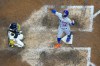 New York Mets' Francisco Lindor reacts in front of Milwaukee Brewers catcher Omar Narvaez after hiiting a grand slam during the seventh inning of a baseball game Tuesday, Sept. 20, 2022, in Milwaukee. (AP Photo/Morry Gash)