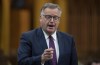 Conservative MP Kevin Waugh rises during Question Period in the House of Commons Tuesday April 13, 2021 in Ottawa. Conservative members of Parliament say the Liberals are playing politics with COVID-19 border restrictions, and talk of scrapping those restrictions may have something to do with the new Conservative leader.THE CANADIAN PRESS/Adrian Wyld