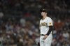 San Diego Padres starting pitcher Blake Snell takes a breath as he works against a St. Louis Cardinals batter during the fifth inning of a baseball game Saturday, Sept. 21, 2022, in San Diego. (AP Photo/Gregory Bull)