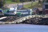 A lobster boat grounded on the rocks at the wharf in Stanley Bridge, P.E.I. on Sunday September 25, 2022. After hammering Atlantic Canada, post-tropical storm Fiona has moved inland in southeastern Quebec, with Environment Canada saying the storm will continue to weaken as it tracks across southeastern Labrador and over the Labrador Sea. THE CANADIAN PRESS/Brian McInnis