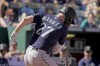 Seattle Mariners' Jesse Winker is hit by a pitch thrown by Kansas City Royals relief pitcher Amir Garrett to score a run during the fifth inning of a baseball game Sunday, Sept. 25, 2022, in Kansas City, Mo. (AP Photo/Charlie Riedel)