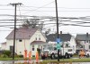 Crews from Nova Scotia Power work on reconnecting the power grid to the Glace Bay Hospital knocked out by Hurricane Fiona, in Glace Bay, N.S., Monday, Sept. 26, 2022. The premier of Nova Scotia has issued a stinging rebuke to the telecommunications companies that serve the province, saying too many Nova Scotians are still without cellphone service, four days after post-tropical storm Fiona roared across Atlantic Canada. THE CANADIAN PRESS/Vaughan Merchant