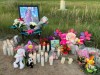 Photos of three-year-old Jemimah Bunadalian sit near candles during a vigil for the Winnipeg girl on July 10, 2021 in this handout photo provided May 26, 2022. A sentencing hearing for a Winnipeg man who pleaded guilty to second-degree murder in the death of his three-year-old daughter is set to take place today. THE CANADIAN PRESS/HO-204 Neighbourhood Watch Inc. Group    **MANDATORY CREDIT**