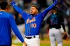 New York Mets' Eduardo Escobar (10) celebrates after hitting a walk-off RBI single during the 10th inning of a baseball game against the Miami Marlins Wednesday, Sept. 28, 2022, in New York. The Mets won 5-4. (AP Photo/Frank Franklin II)