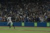 Fans react as New York Yankees designated hitter Aaron Judge (99) rounds first base after hitting his 61st home run of the season, a two-run shot, against the Toronto Blue Jays during seventh inning American League MLB baseball action in Toronto on Wednesday, Sept. 28, 2022. THE CANADIAN PRESS/Alex Lupul