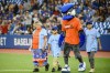 Dolores Naponse, 72, of Atikameksheng Anishnawbek First Nation near Sudbury, Ont., walks on field with her grandsons Keewehtn and Jeffrey Cheechoo to throw the ceremonial first pitch before the start of AL MLB baseball action between the Boston Red Sox and Toronto Blue Jays in Toronto on Friday, September 30, 2022. THE CANADIAN PRESS/Christopher Katsarov