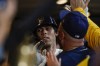Milwaukee Brewers' Christian Yelich is congratulatedf in the dugout after hitting a home run during the first inning of a baseball game against the Arizona Diamondbacks Monday, Oct. 3, 2022, in Milwaukee. (AP Photo/Morry Gash)