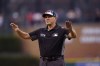 FILE - Umpire Chad Fairchild calls a play review safe during the fourth inning of the second baseball game of a doubleheader between the Detroit Tigers and the Cleveland Guardians, Monday, July 4, 2022, in Detroit. A rule change at the beginning of the season designed to explain on-field call challenges and outcomes introduced umpires’ voices to ballpark speakers, to the fans in their seats and to the world at home for the first time. (AP Photo/Carlos Osorio, File)