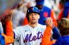 New York Mets' Brandon Nimmo celebrates with teammates after hitting a home run during the fourth inning in the first baseball game of a doubleheader against the Washington Nationals, Tuesday, Oct. 4, 2022, in New York. (AP Photo/Frank Franklin II)