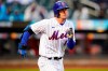 New York Mets' Jeff McNeil (1) runs to first base for a single during the third inning in the first baseball game of a doubleheader against the Washington Nationals, Tuesday, Oct. 4, 2022, in New York. The Mets won 4-2. (AP Photo/Frank Franklin II)