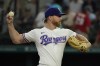 Texas Rangers starting pitcher Jon Gray throws during the first inning of the first baseball game of a doubleheader against the New York Yankees in Arlington, Texas, Tuesday, Oct. 4, 2022. (AP Photo/LM Otero)