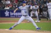 Kansas City Royals starting pitcher Brady Singer delivers against the Cleveland Guardians during the first inning of a baseball game in Cleveland, Friday, Sept. 30, 2022. (AP Photo/Phil Long)