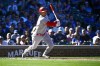 Cincinnati Reds' Kyle Farmer hits a one run single against the Chicago Cubs during the third inning of a baseball game, in Chicago, Saturday, Oct. 1, 2022. (AP Photo/Matt Marton)
