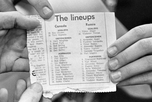 PETER BREGG / THE CANADIAN PRESS FILES
                                Members of the media hold up the lineup sheet listing the Canadian and USSR players in advance of Game 1 in Montreal.