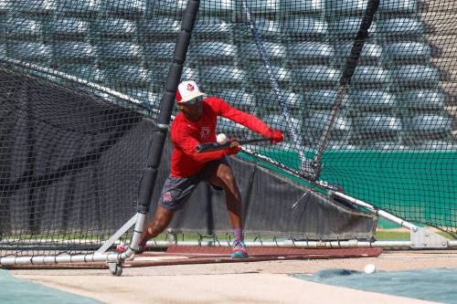 MIKE DEAL / WINNIPEG FREE PRESS
                                Reggie Pruitt Jr. lays down a bunt Tuesday during Goldeyes practice at Shaw Park. The Fish open the playoffs Wednesday night at home against the Fargo-Moorhead Redhawks.