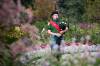 JOHN WOODS / WINNIPEG FREE PRESS
                                Colin Tighe, bagpiper in the Lord Selkirk Robert Fraser Memorial Pipe Band, plays at the English Garden in Assiniboine Park Sunday.