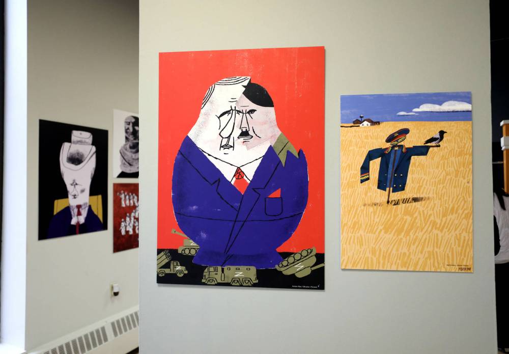 Ukranian artists Mari Kinovych (right) and Anton Abo (left) have works featured in the Picoric exhibit at the Oseredok Ukrainian Cultural and Education Centre. (Ruth Bonneville / Winnipeg Free Press)