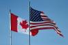 THE CANADIAN PRESS FILES/John Woods
                                Canadian and U.S. flags fly at the international border crossing at Emerson, MB.