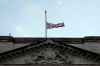 The Union flag on Buckingham Palace in London is lowered after the death of Britain's Queen Elizabeth II, Thursday, Sept. 8, 2022. Queen Elizabeth II, Britain's longest-reigning monarch and a rock of stability across much of a turbulent century, died Thursday after 70 years on the throne. She was 96. (AP Photo/Frank Augstein)