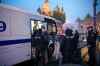 Police officers escort detained demonstrators into a police bus during a protest against a partial mobilization new Red Square with the St. Basil's Cathedral in the background in Moscow, Russia, Saturday, Sept. 24, 2022. (AP Photo)