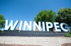 ETHAN CAIRNS / WINNIPEG FREE PRESS

Jaden, Bryce and Tait Loewen climb the Winnipeg sign in their every child matters shirts for the A New Day ceremony at The Forks Plaza in Winnipeg, Manitoba on Friday, July 1,  2022