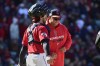 Cleveland Guardians catcher Austin Hedges, left, talks with manager Terry Francona, right, during a pitching change in the tenth inning of a wild card baseball playoff game against the Tampa Bay Rays, Saturday, Oct. 8, 2022, in Cleveland. (AP Photo/Phil Long)