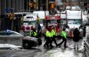 Police officers patrol on foot along Albert Street as a protest against COVID-19 restrictions that has been marked by gridlock and the sound of truck horns reaches its 14th day, in Ottawa, Thursday, Feb. 10, 2022. THE CANADIAN PRESS/Justin Tang