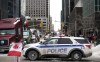 An Ottawa Police vehicle blocks off Kent Street in front of parked trucks during the 