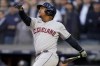 Cleveland Guardians Jose Ramirez follows through on a sacrifice fly to drive in Austin Hedges during the third inning of Game 5 of an American League Division baseball series against the New York Yankees, Tuesday, Oct. 18, 2022, in New York. (AP Photo/John Minchillo)
