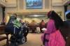 People with disabilities testify in support of a proposed ban on street camping during a city council meeting in Portland, Ore., on Oct. 26, 2022. Hundreds of Portlanders testified at the meeting, during which a resolution was introduced that would ban homeless encampments and create designated campsites sanctioned by the city. A group of people with disabilities has sued the city, saying that encampments make public sidewalks inaccessible. (AP Photo/Claire Rush)