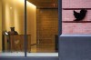 FILE - A receptionist works in the lobby of the building that houses the Twitter office in New York, Wednesday, Oct. 26, 2022. Employees were bracing for widespread layoffs at Twitter Friday, Nov. 4, as new owner Elon Musk overhauls the social platform. (AP Photo/Mary Altaffer, File)