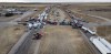 Anti-mandate demonstrators gather as a truck convoy blocks the highway the busy U.S. border crossing in Coutts, Alta., Monday, Jan. 31, 2022. Police in Lethbridge say there could be traffic congestion in the southern Alberta city as a convoy of vehicles arrives to support three men charged in the Coutts blockade. THE CANADIAN PRESS/Jeff McIntosh