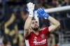 Los Angeles FC goalkeeper Maxime Crepeau gestures to fans as he warms up for an MLS playoff soccer match against the LA Galaxy in Los Angeles on October 20, 2022. THE CANADIAN PRESS/AP, Ringo H.W. Chiu